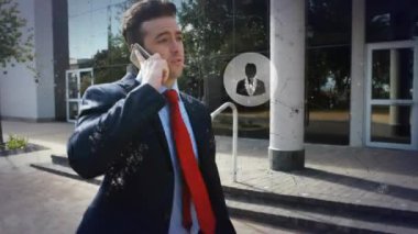 Animation of data processing over caucasian businessman using smartphone. Global business, finances, computing and data processing concept digitally generated video.