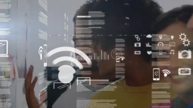 Animation of data processing with icons over diverse people. Global technology, finances and digital interface concept digitally generated video.