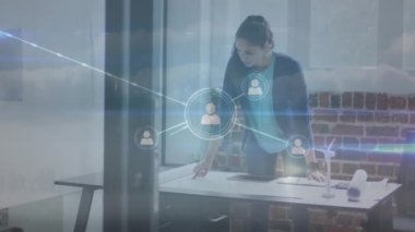 Animation of network of connections over biracial businesswoman in office. Global networks, business, finances, computing and data processing concept digitally generated video.