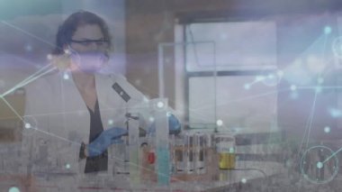 Animation of network of connections over caucasian female scientist wearing face mask. Global covid 19 pandemic, business, finances, computing and data processing concept digitally generated video.