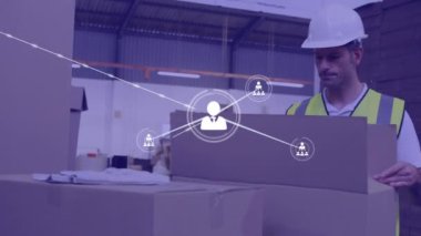 Animation of network of connections over caucasian man working in warehouse. Global shipping, business, finances, computing and data processing concept digitally generated video.