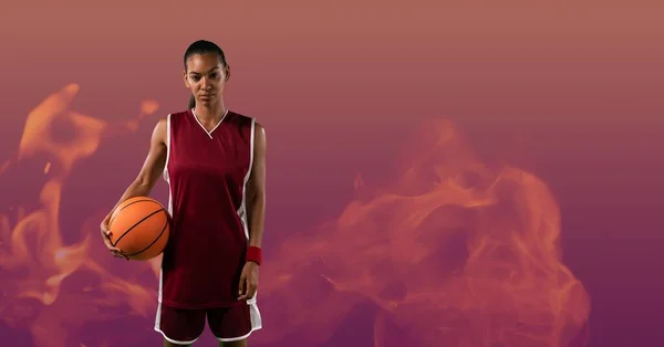 Composition Female Basketball Player Standing Holding Ball Smoke Red Background — Stock fotografie