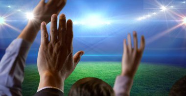 Composition of group of businesspeople raising hands over sports stadium. sport and competition, business and finance concept digitally generated image.