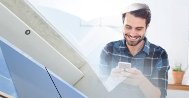 Composition of smiling caucasian businessman using smartphone with modern building. global technology and communication concept digitally generated image.