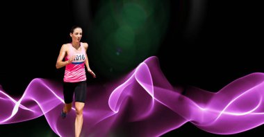 Composition of female athlete running with copy space and pink light trails. sports and competition concept digitally generated image.