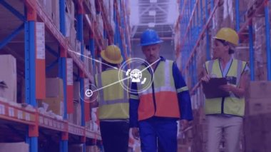 Animation of network of icons over caucasian male and female supervisor discussing at warehouse. Global networking and logistics business technology concept
