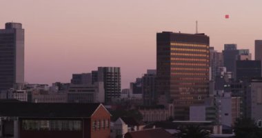 Animation of financial data processing over cityscape. Global business, finances, computing and data processing concept digitally generated video.
