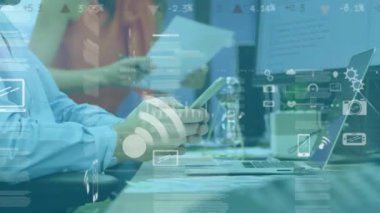 Animation of screens with dat processing against mid section of a man using smartphone at office. Computer interface and business technology concept