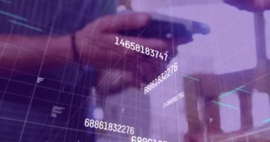 Animation of numbers and data processing over close up of a hand using phone to make a payment. Digital payment and business technology concept