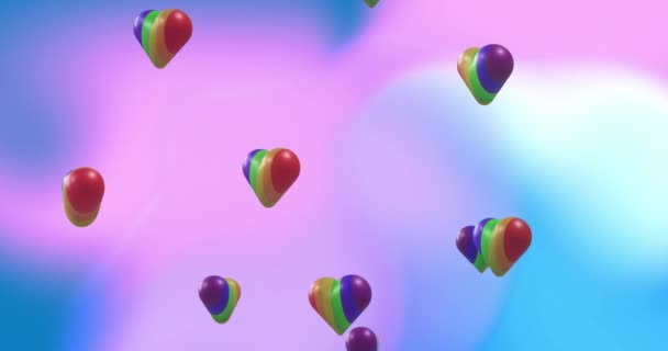 彩虹心在梯度背景下旋转的动画 Lgbt和平等概念数字生成的视频 — 图库视频影像