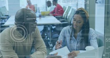 Animation of interface with data processing over african american man and woman discussing at office. Computer interface and business technology concept