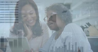 Animation of financial data processing over african american mother and adult daughter using tablet. Global business, finances and digital interface concept digitally generated video.