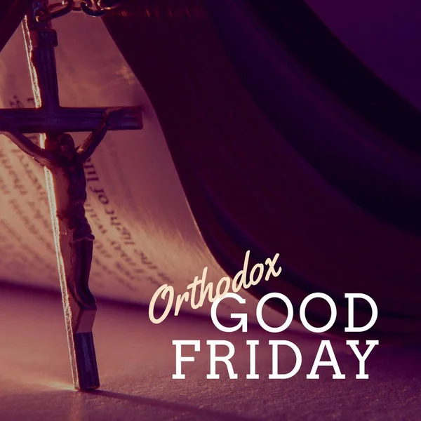 Composition of orthodox good friday text and copy space over christian cross and holy bible. Orthodox good friday, christianity, faith and religion concept digitally generated image.
