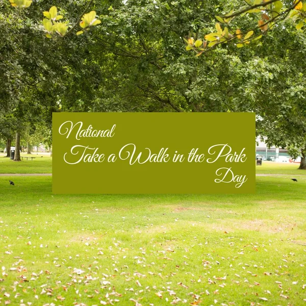Image of national take a walk in the park day text over park. National take a walk in the park day and celebration concept digitally generated image.