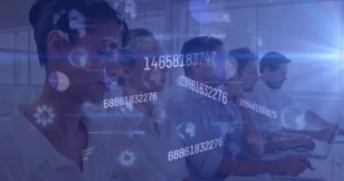Animation of data processing over diverse business people working in office. Global business, finances, computing and data processing concept digitally generated video.