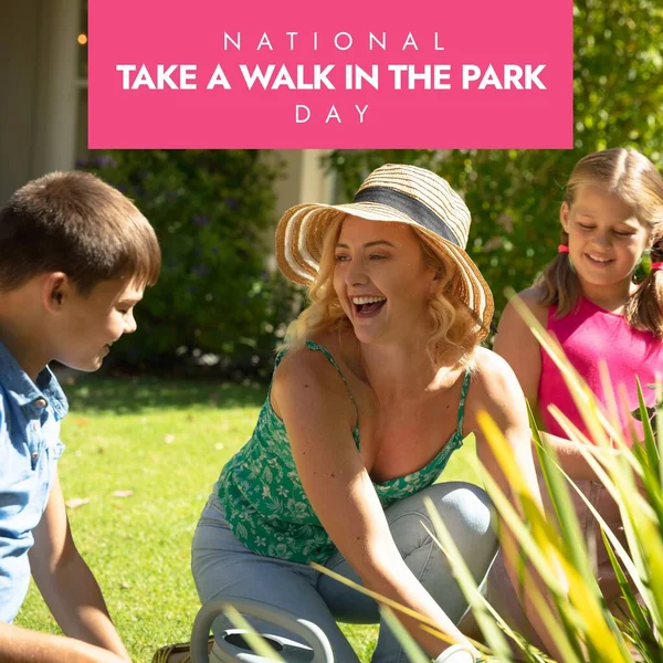 National take a walk in the park day text over happy caucasian mother with children in garden. National take a walk in the park day and celebration concept digitally generated image.