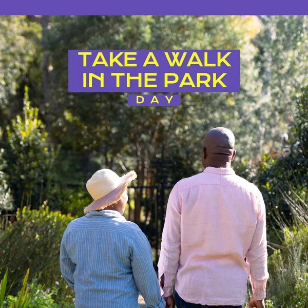 National take a walk in the park day text over happy senior african american couple in park. National take a walk in the park day and celebration concept digitally generated image.