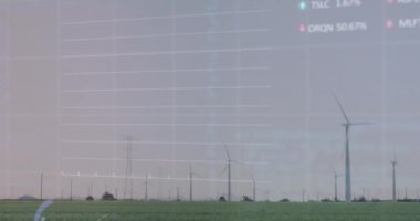 Çayır üzerinde dönen yel değirmenlerine karşı istatistiksel ve borsa veri işleme animasyonu. Küresel ekonomi ve yenilenebilir enerji teknolojisi kavramı