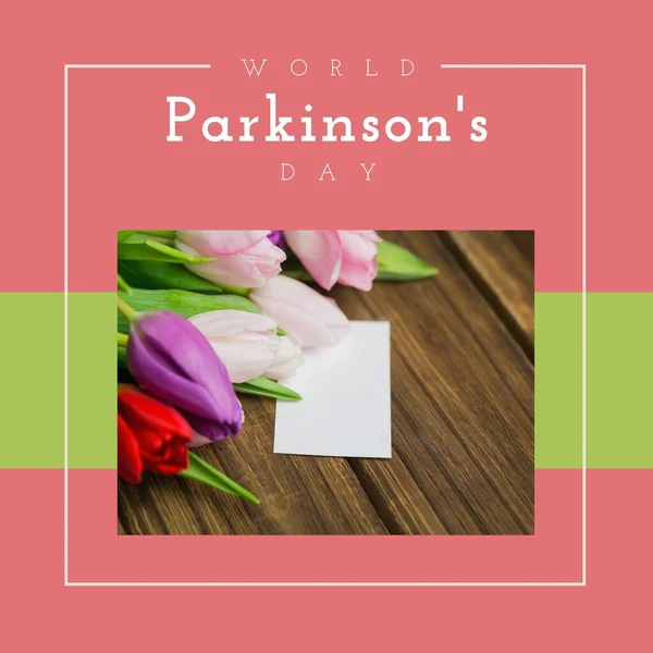 World parkinson\'s day and raise awareness to parkinson\'s disease text with flowers and note on table. Copy space, nature, composite, nervous system, campaign, healthcare, support and prevention.