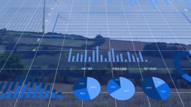 Yeşil arazilerdeki yel değirmeni üzerinde açık gökyüzüne karşı birden fazla grafik ve sayının animasyonu. Dijital bileşik, çoklu pozlama, rapor, iş yeri, manzara, yeşil ve sürdürülebilir enerji kavramı.