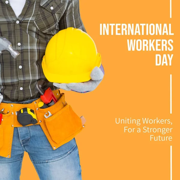 Composition of international workers day text over worker with helmet. International workers day and labour concept digitally generated image.