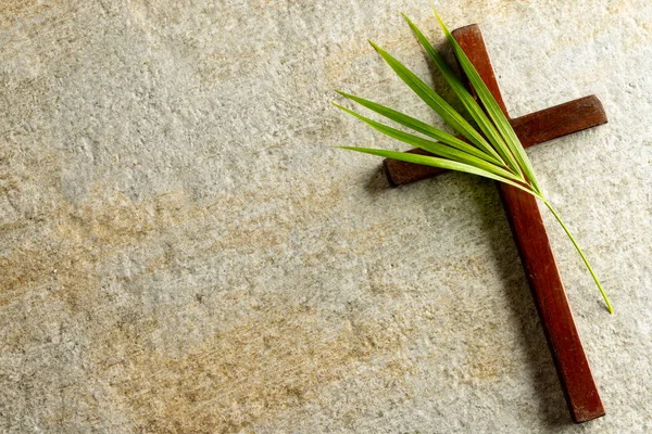 stock image Image of close up of cross with palm leaf and copy space on stone background. Easter, religion, tradition and celebration concept.