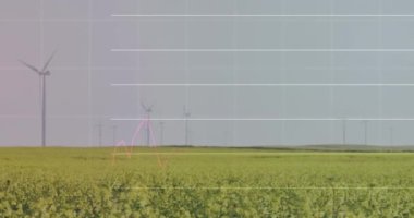 Çayırlarda gri gökyüzüne karşı dönen yel değirmenlerinin istatistiksel veri işleme sistemi. İş verileri ve yenilenebilir enerji teknolojisi kavramı