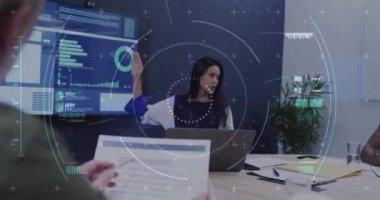 Animation of financial data processing over diverse business people in office. Global business, finances, computing and data processing concept digitally generated video.