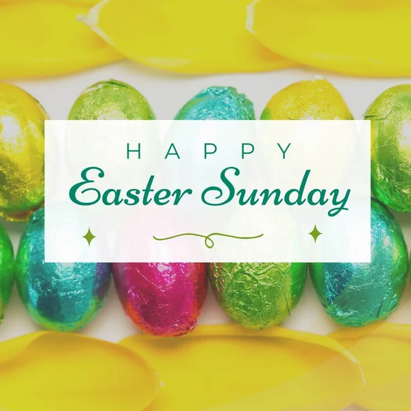 Image of happy easter sunday text over chocolate easter eggs. Easter sunday and celebration concept digitally generated image.
