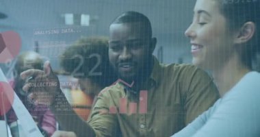 Animation of financial data processing over diverse business people working in office. Global business, finances, computing and data processing concept digitally generated video.