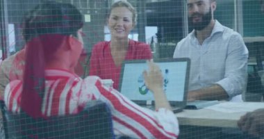 Animation of financial data processing over diverse business people working in office. Global business, finances, computing and data processing concept digitally generated video.