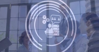 Animation of icons and data processing over diverse business people. Global business, finances, computing and data processing concept digitally generated video.