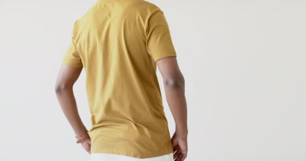 Midsection African American Man Wearing Yellow Shirt Copy Space White — Stock Video