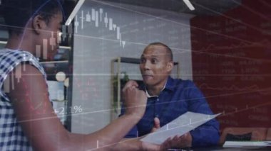 Animation of data processing over diverse business people working in office. Global business, finances, computing and data processing concept digitally generated video.