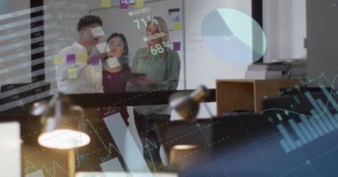 Animation of financial data processing over diverse business people working in office. Global business, finances, computing and data processing concept digitally generated video.