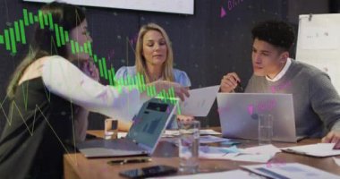 Animation of financial data processing over diverse business people working in office. Global business, finances, computing and data processing concept digitally generated video.