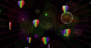 Gururlu gökkuşağı kalplerinin ve siyah arka planda patlayan havai fişeklerin animasyonu. Gurur ayı, lgbt, insan hakları ve eşitlik kavramı dijital olarak oluşturulmuş video.