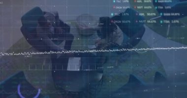Animation of financial data processing over diverse business people. Global business, finances, computing and data processing concept digitally generated video.