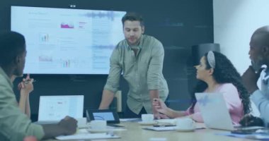 Animation of data processing over diverse business people working in office. Global business, finances, computing and data processing concept digitally generated video.