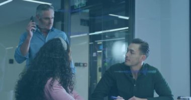 Animation of data processing over diverse business people working in office. Global business, finances, computing and data processing concept digitally generated video.