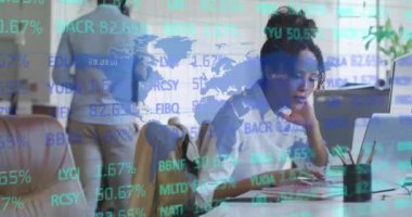 Animation of data processing over diverse business people in office. Global business, finances, computing and data processing concept digitally generated video.