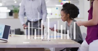 Animation of financial data processing over diverse business people in office. Global business, finances, computing and data processing concept digitally generated video.