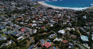General view of cityscape with houses, mountains, sea and blue sky. Travel and landscape concept.