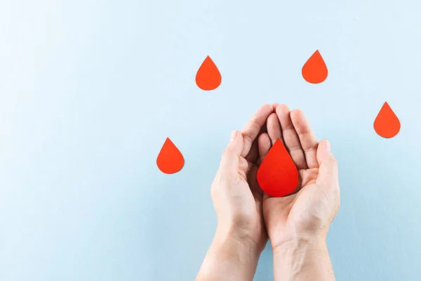 Hands Caucasian Woman Cupping Blood Drop Blood Drops Blue Background — Stock Photo, Image
