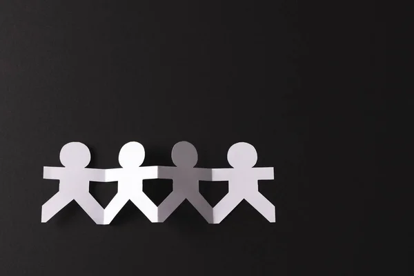 Close Four Paper Cut Out People Figures Holding Hands Copy — Stock Photo, Image