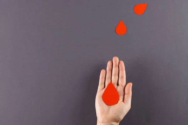 Hand Caucasian Woman Holding Blood Drop Blood Drops Grey Background — Stock Photo, Image