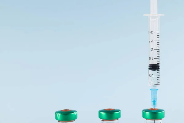 Three Vials Syringe Filling One Blue Background Copy Space Blood — Stock Photo, Image