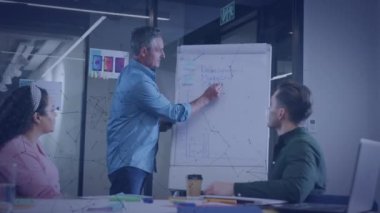 Animation of financial data processing over diverse business people in office. Global business, finances, computing and data processing concept digitally generated video.
