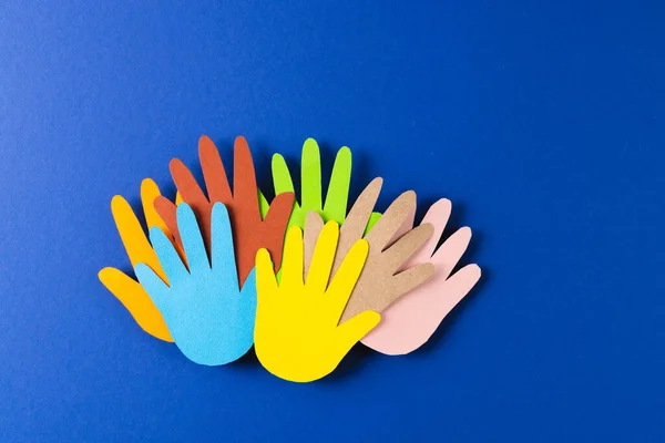 Close Paper Cut Out Multi Coloured Hands Copy Space Blue — Stock Photo, Image
