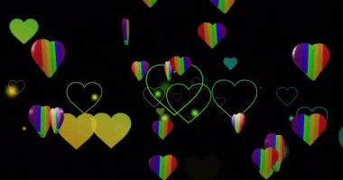 Siyah arka planda gökkuşağı kalplerinin animasyonu. Gurur ayı, lgbtq, insan hakları ve eşitlik kavramı dijital olarak oluşturulmuş video.